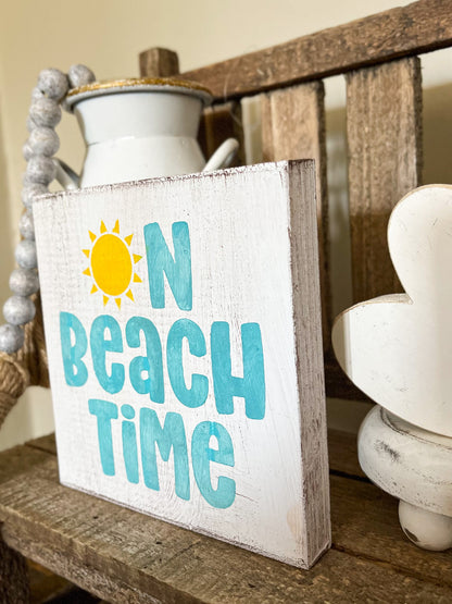 On beach time sign