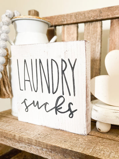 Laundry sucks sign