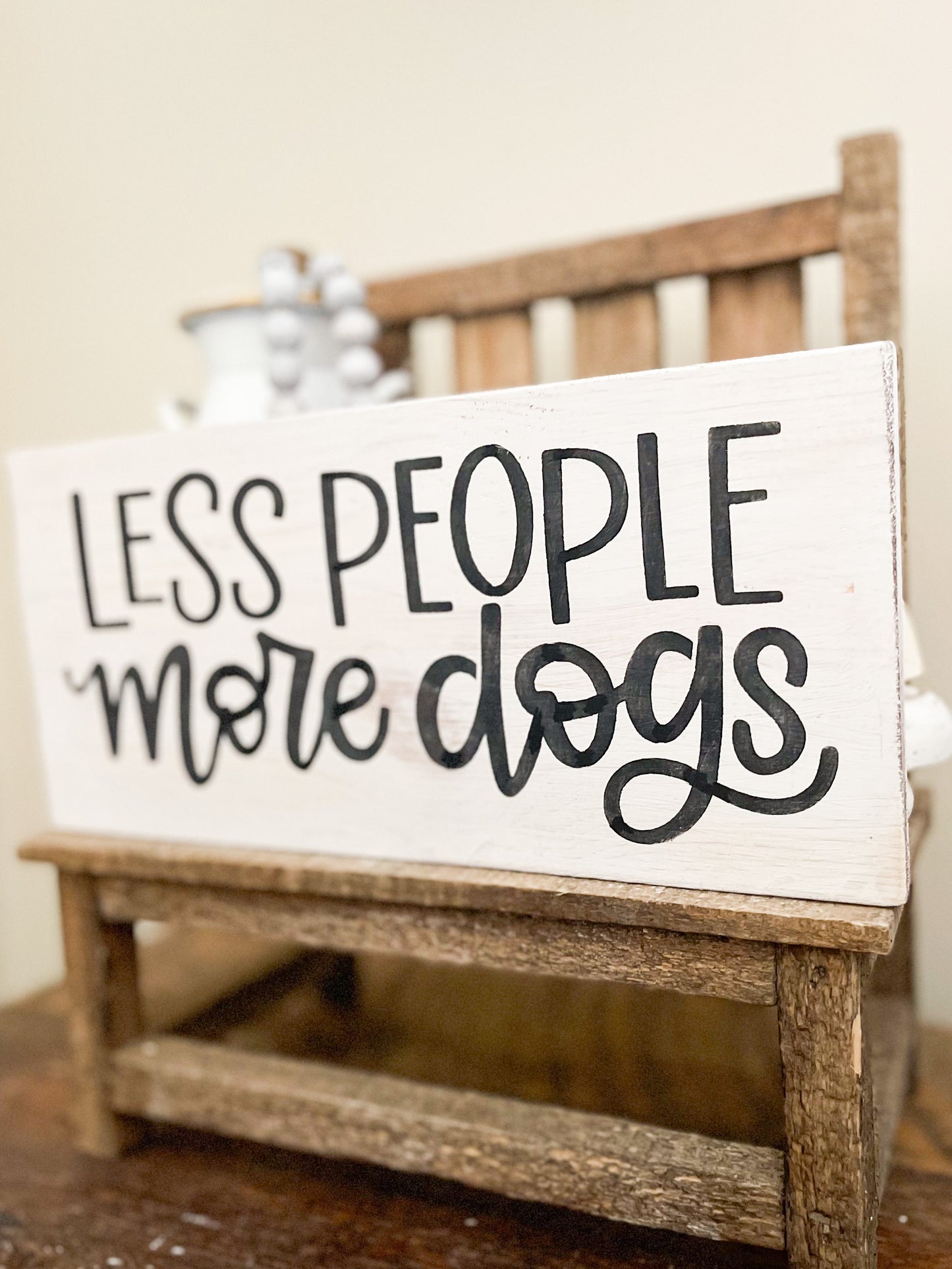 Less people more dogs sign