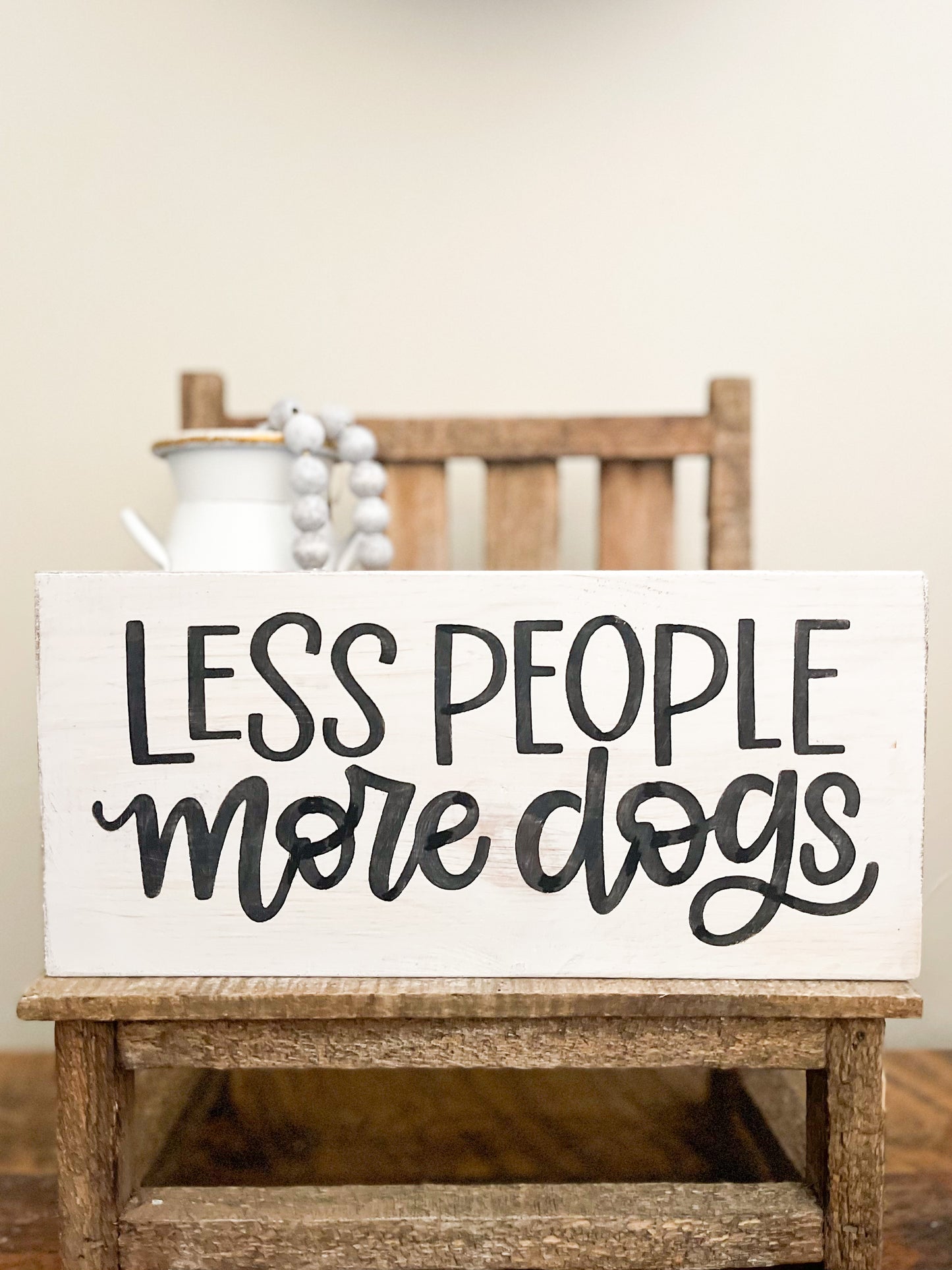 Less people more dogs sign